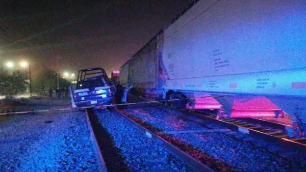 Elementos de seguridad acordonan el área donde ocurrió el enfrentamiento por intento de robo a tren