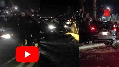 Aficionados rodean el vehículo del conductor señalado de atropellar a varias personas durante una celebración en Zempoala.